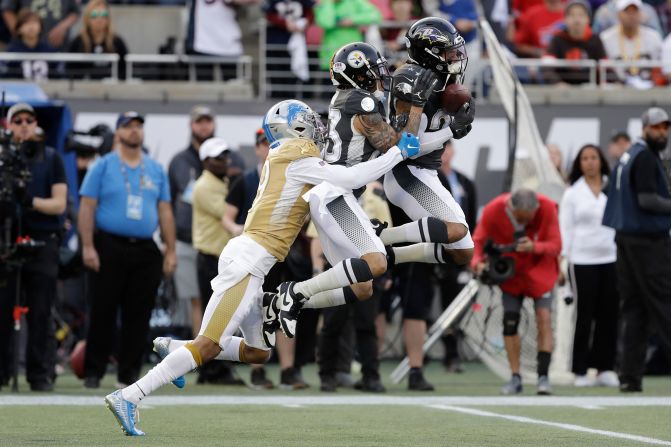 Minnesota Vikings cornerback Xavier Rhodes intercepts a pass intended for Detroit Lions wide receiver Kenny Golladay during the NFL Pro Bowl football game on Sunday, January 26, in Orlando, Florida. The AFC defeated the NFC 38-33.