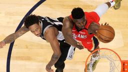 NEW ORLEANS, LOUISIANA - JANUARY 22: Zion Williamson #1 of the New Orleans Pelicans makes a shot over DeMar DeRozan #10 of the San Antonio Spurs at Smoothie King Center on January 22, 2020 in New Orleans, Louisiana. NOTE TO USER: User expressly acknowledges and agrees that, by downloading and/or using this photograph, user is consenting to the terms and conditions of the Getty Images License Agreement.   (Photo by Chris Graythen/Getty Images)