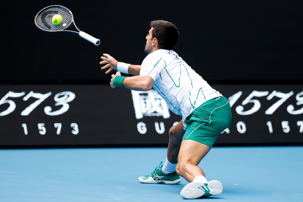 Novak Djokovic throws his racquet in an attempt to return the ball during his match against Tatsuma Ito on Day 3 of the Australian Open on Wednesday, January 22. 