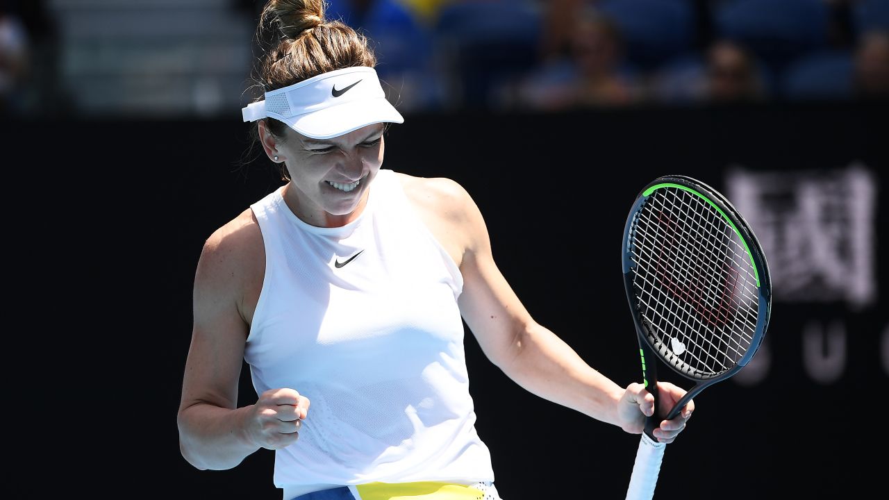 Simona Halep celebrates defeating Elise Mertens at the Australian Open.