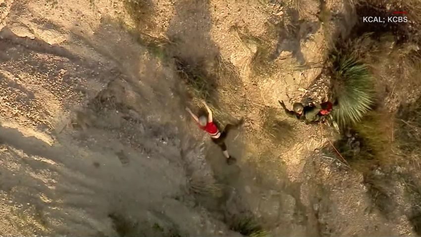 Woman rescued from cliff