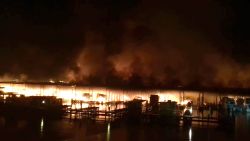 This photo provided by Mandy Durham shows a fire burning on a dock where at least 35 vessels, many of them houseboats, were destroyed by fire early Monday, Jan. 27, 2020, in Scottsboro, Ala. Scottsboro Fire Chief Gene Necklaus is confirming fatalities in a massive fire at a boat dock.