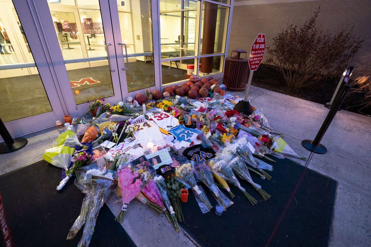 Flowers, jerseys and other memorabilia is left at the entrance of the Bryant Gymnasium at Lower Merion High School in Wynnewood, Pennsylvania, on January 27.