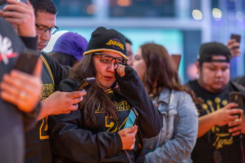 People mourn for former NBA star Kobe Bryant near the Staples Center on January 26.