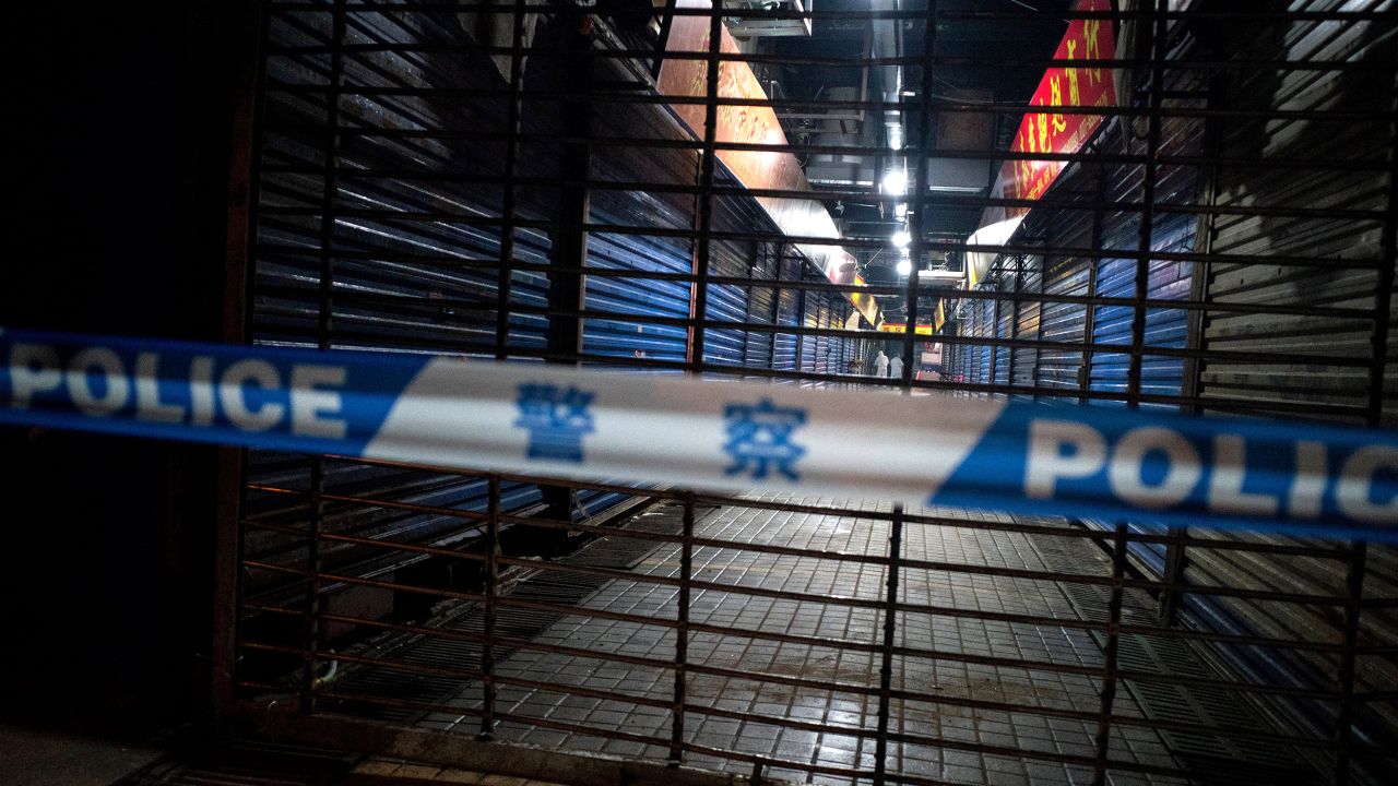 Members of staff of the Wuhan Hygiene Emergency Response Team conduct searches of the closed Huanan Seafood Wholesale Market in the city of Wuhan, in the Hubei Province, on January 11.