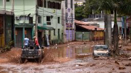 A truck rides along a flooded street after the overflowing of the Das Velhas River in Sabara, Belo Horizonte.