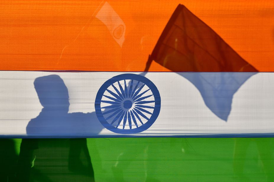 A Muslim youth waves the Indian flag during a protest held by the Muslim community in Bangalore on January 24.