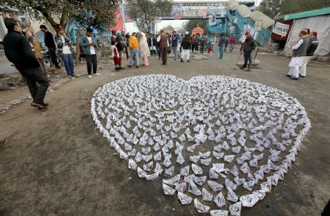 A heart made of paper boats with slogans on them rests near a protest in the Shaheen Bagh neighborhood in New Delhi on Wednesday, January 16.