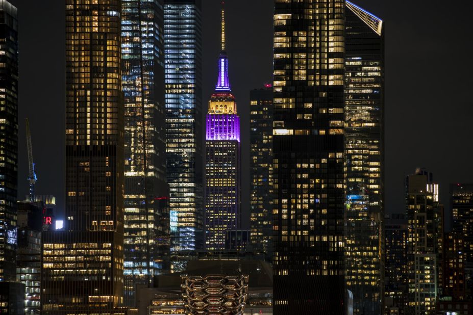 The Empire State Building is illuminated gold and purple to honor Kobe Bryant on January 28. 