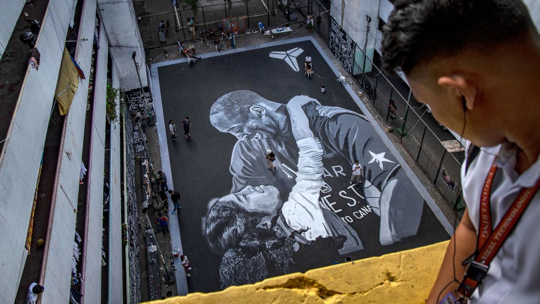 A mural of Kobe Bryant and his daughter Gianna adorns a basketball court on Monday, January 28, in Taguig, Metro Manila, Philippines.