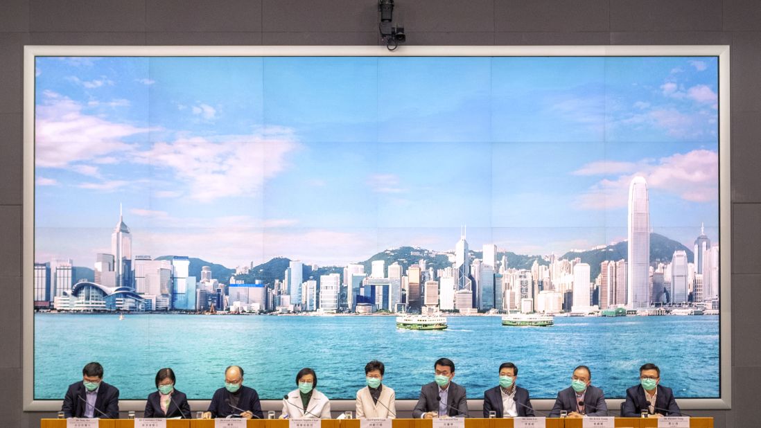 Hong Kong Chief Executive Carrie Lam, center, attends a news conference in Hong Kong on January 28, 2020. Lam said China would stop individual travelers to Hong Kong while closing some border checkpoints and restricting flights and train services from the mainland.