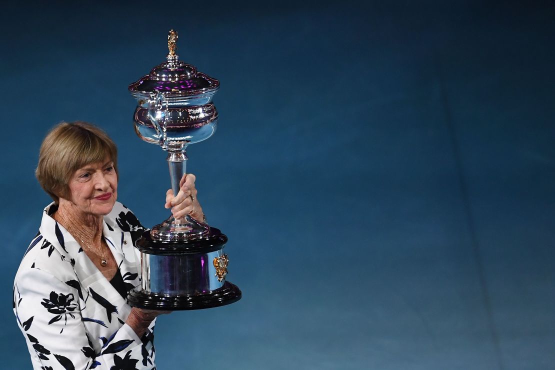 Margaret Court poses with a replica  trophy to commemorate 50 years of her Australian grand slam win.