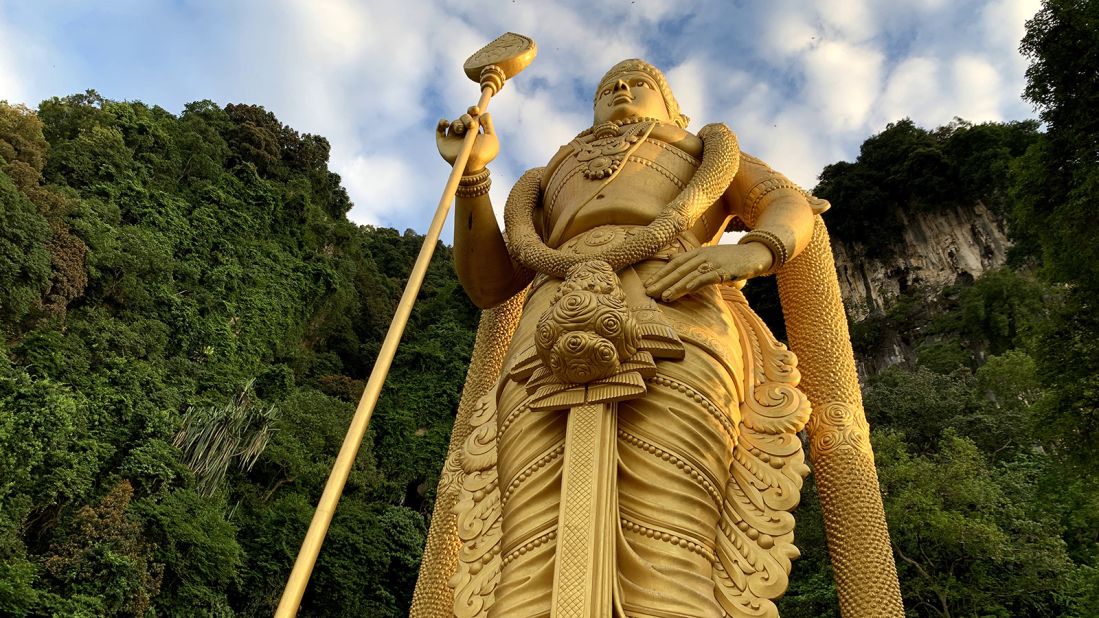 <strong>Lord Murugan: </strong>A 140-foot-tall gold statue of Lord Murugan, the Hindu god of war, stands at the base of the caves.