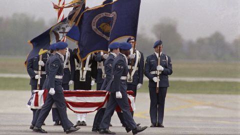 Military guards transfer caskets bearing remains of Challenger's crew, which exploded after liftoff.