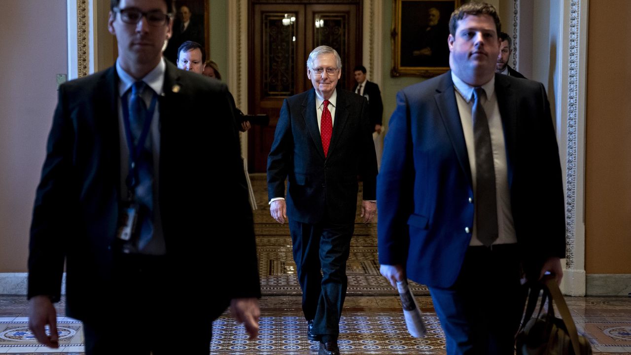 Senate Majority Leader Mitch McConnell, a Republican from Kentucky, center, arrives to the US Capitol on Tuesday, January 21.