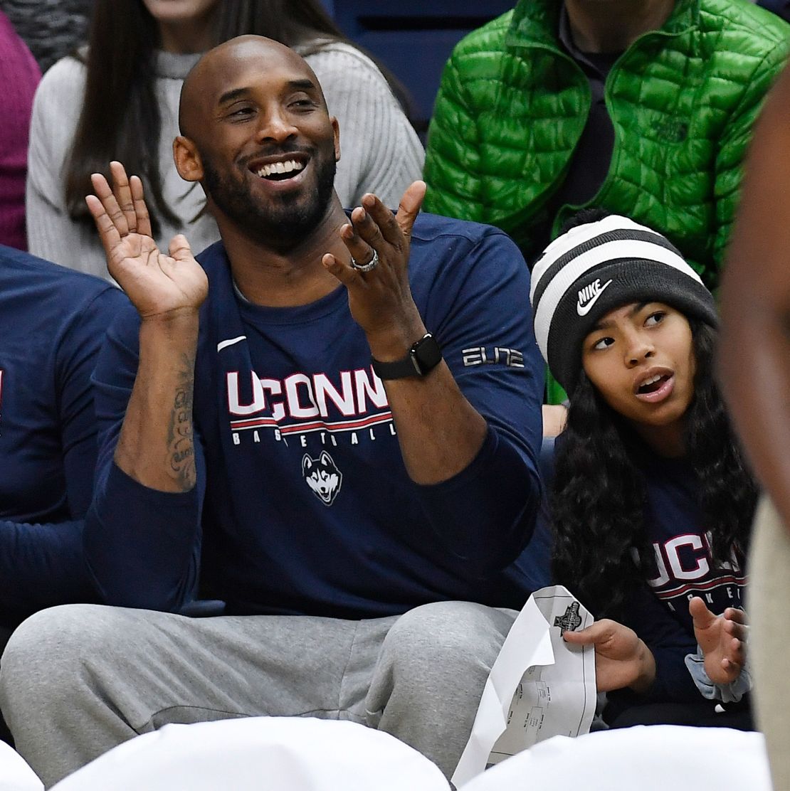 Kobe Bryant and his daughter Gianna watch the NCAA college basketball game between Connecticut and Houston on March 2.