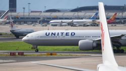 A United Airlines Boeing 777 aircraft waits to take off at Beijing airport on July 25, 2018. - Beijing hailed "positive steps" as major US airlines and Hong Kong's flag carrier moved to comply on July 25 with its demand to list Taiwan as part of China, sparking anger on the island. (Photo by GREG BAKER / AFP)        (Photo credit should read GREG BAKER/AFP via Getty Images)
