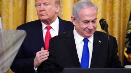 US President Donald Trump and Israeli Prime Minister Benjamin Netanyahu take part in an announcement of Trump's Middle East peace plan in the East Room of the White House in Washington, DC on January 28, 2020. - Trump declared that Israel was taking a "big step towards peace" as he unveiled a plan aimed at solving the Israeli-Palestinian conflict. "Today, Israel takes a big step towards peace," Trump said, standing alongside Netanyahu as he revealed details of the plan already emphatically rejected by the Palestinians. (Photo by MANDEL NGAN / AFP) (Photo by MANDEL NGAN/AFP via Getty Images)