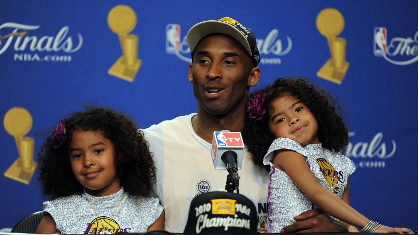 LOS ANGELES, CA - JUNE 17:  Kobe Bryant #24 of the Los Angeles Lakers speaks during the post game news conference with daughters Natalia and Gianna Bryant as he celebrates after the Lakers defeated the Boston Celtics 83-79 in Game Seven of the 2010 NBA Finals at Staples Center on June 17, 2010 in Los Angeles, California.  NOTE TO USER: User expressly acknowledges and agrees that, by downloading and/or using this Photograph, user is consenting to the terms and conditions of the Getty Images License Agreement.  (Photo by Lisa Blumenfeld/Getty Images)