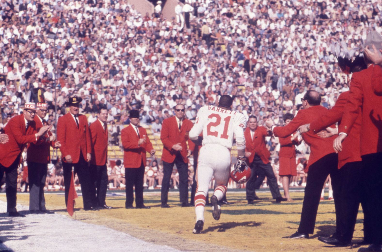 Chiefs running back Mike Garrett runs onto the field during pregame introductions.