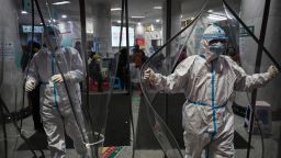 Medical staff members wearing protective clothing to help stop the spread of a deadly virus, in Wuhan on January 25, 2020. 