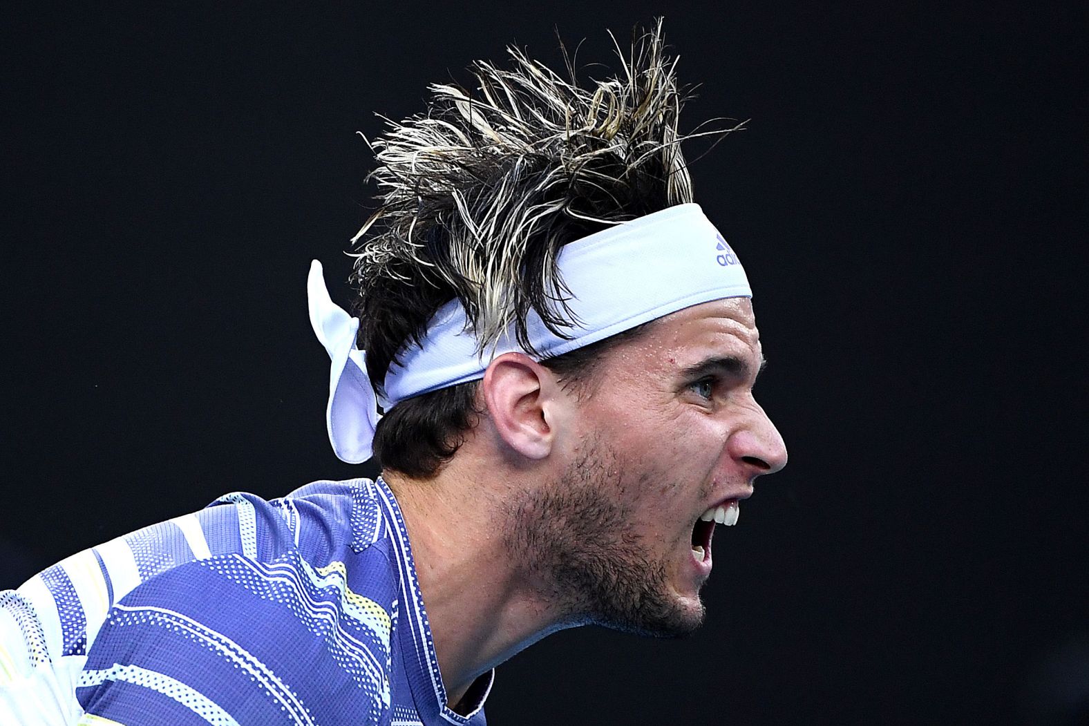 Dominic Thiem hits a serves during his quarterfinal clash against Rafael Nadal on January 29. Thiem defeated the 2009 champion in four sets.