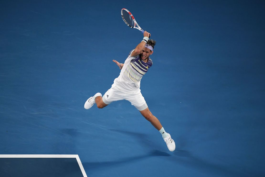 Thiem blasts a return against Nadal on his way to victory.