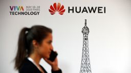 PARIS, FRANCE - MAY 17: A visitor phones in front of the Huawei Technologies Co. logo during the 4th edition of the Viva Technology show at Parc des Expositions Porte de Versailles on May 17, 2019 in Paris, France. Viva Technology, the new international event brings together 9000 startups with top investors, companies to grow businesses and all players in the digital transformation who shape the future of the internet. (Photo by Chesnot/Getty Images)