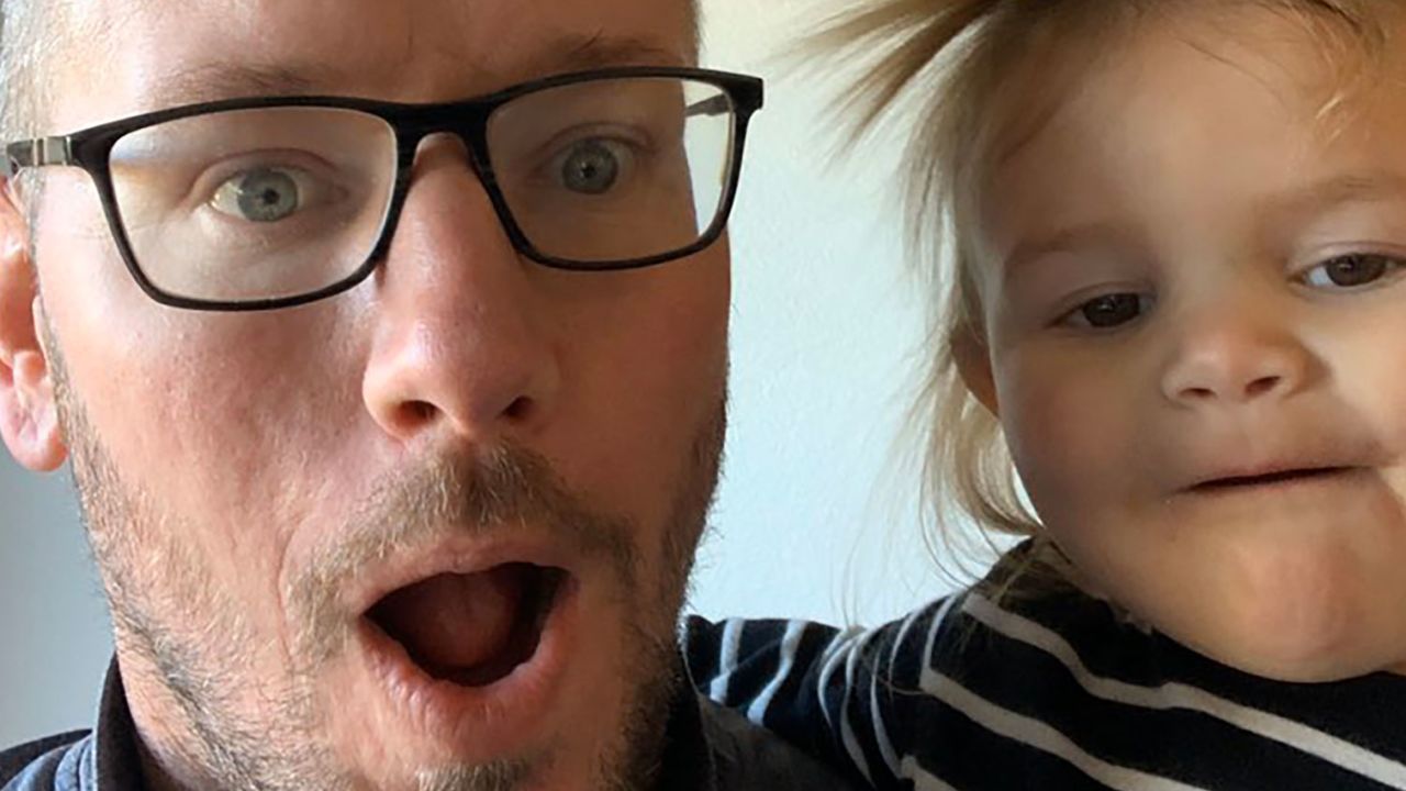 Jeremy Hefner with one of his daughters.