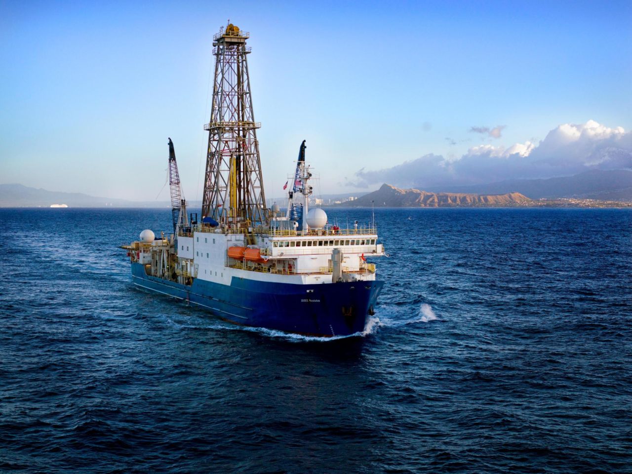 The JOIDES Resolution leaving Hawaii in 2009 to begin Expedition 320. Named after Captain James Cook's ship the HMS Resolution, she has travelled to all corners of the world, and as a result <a href="https://joidesresolution.org/frequently-asked-questions/" target="_blank" target="_blank">doesn't have a home port</a>. 