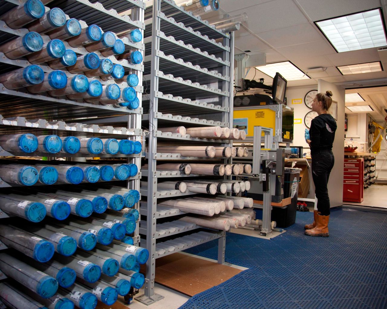 Racks of core samples aboard the Resolution in 2012. After an initial inspection, cores are split lengthways, with one half tested further. Cores are then refrigerated and stored for future scientific evaluation.