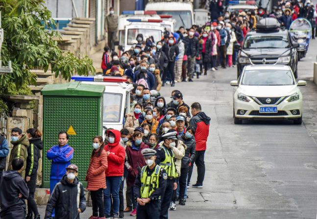 Nanning, China, residents line up to buy face masks from a medical appliance store on January 29, 2020.
