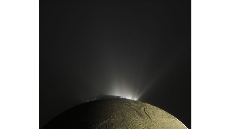 "Enceladus Plumes" -- A back-lit view of water-ice plumes at the south pole of Saturn's moon of Enceladus, and surface Saturnshine, as seen by Cassini.