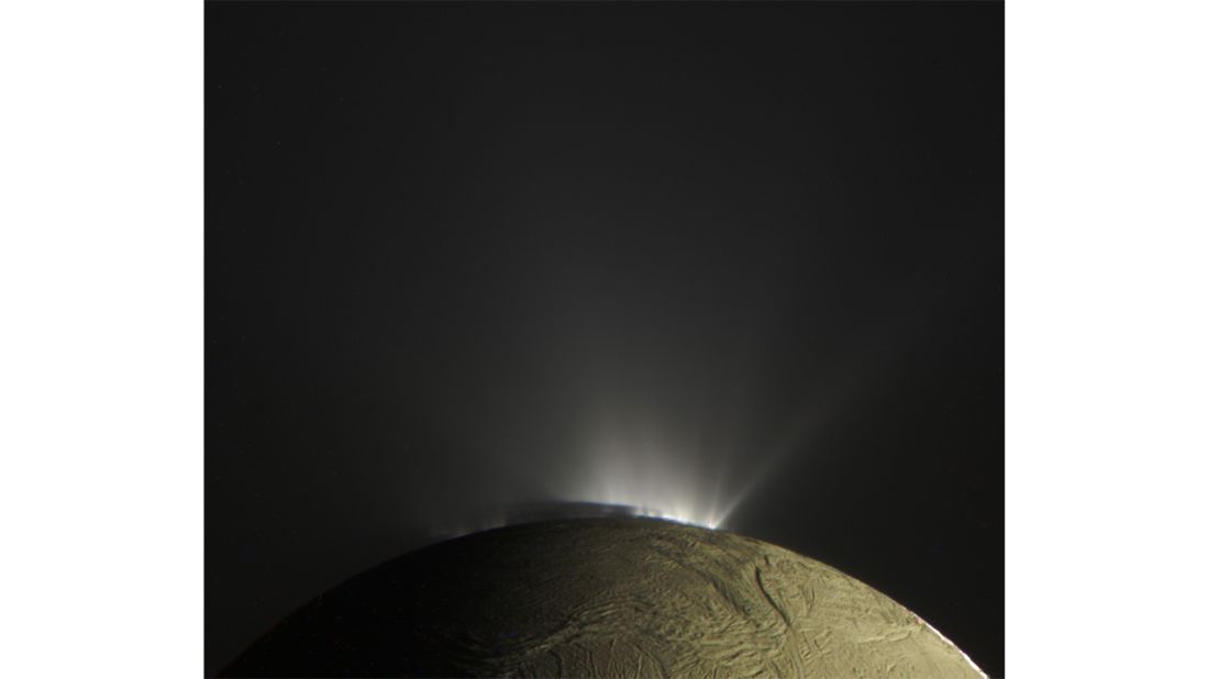 "Enceladus Plumes" -- A back-lit view of water-ice plumes at the south pole of Saturn's moon of Enceladus, and surface Saturnshine, as seen by Cassini.