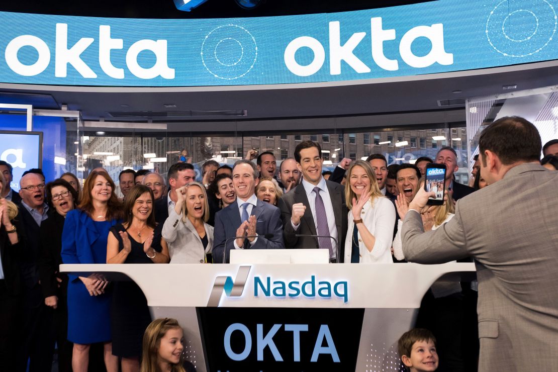 Okta cofounders Todd McKinnon, center right, and Frederic Kerrest, center left, celebrate with their wives and others the day Okta went public.
