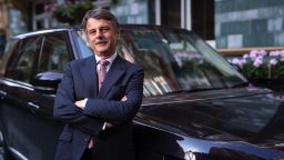 Ralf Speth, chief executive officer of Jaguar Land Rover Plc, a unit of Tata Motors Ltd., poses for a photograph with one of the company's Range Rover Autograph SUV automobiles following a Bloomberg Television interview in London, U.K., on Monday, Sept. 8, 2014. Jaguar is introducing a new entry-level sedan, the XE saloon, challenging Bayerische Motoren Werke AG's most popular model, as part of a push to triple sales by building vehicles more people can afford. Photographer: Jason Alden/Bloomberg via Getty Images 
