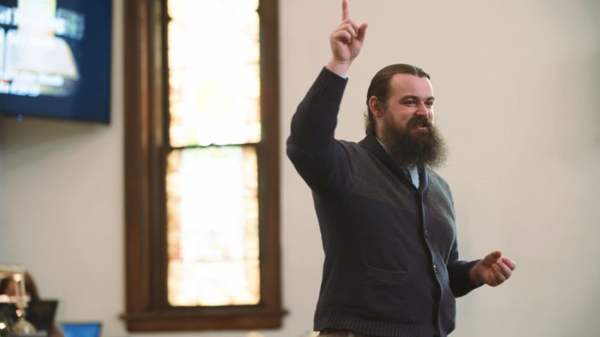 Pastor Luke Fillmore from The United Methodist Church in Hamburg, Iowa, asks his congregants to think about how they can help rebuild their community after massive floods nearly wiped out the town in March 2019.
