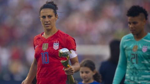 Carli Lloyd holds the World Cup during the US victory tour against Portugal.
