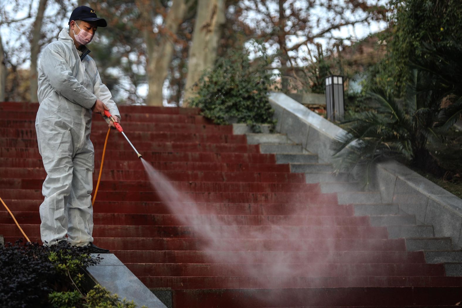 A worker disinfects the grounds near the Wuhan Huoshenshan hospital construction site on January 28.