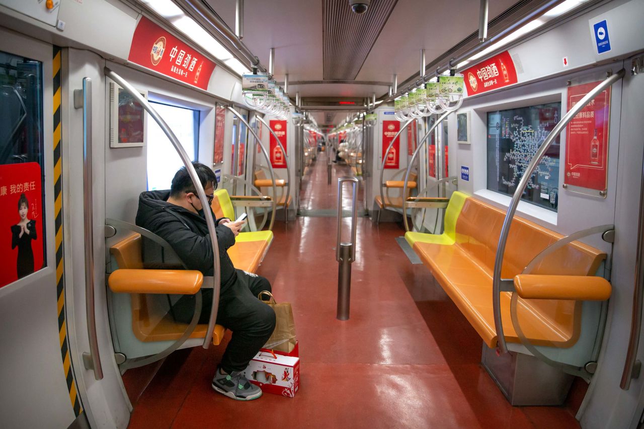 A passenger rides a deserted subway train in Beijing on January 26.