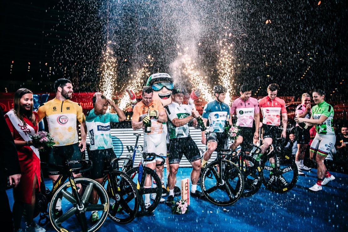 Esow (third left) and the other Berlin Six Day sprinters are sprayed with champagne by retiring former Olympic gold medallist Miriam Welte (far right) at a ceremony on the final night of competition.