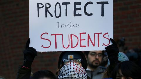 Cassidy Taylor offers support to a deported Iranian student while protesting outside the federal courthouse in Boston on January 21. 