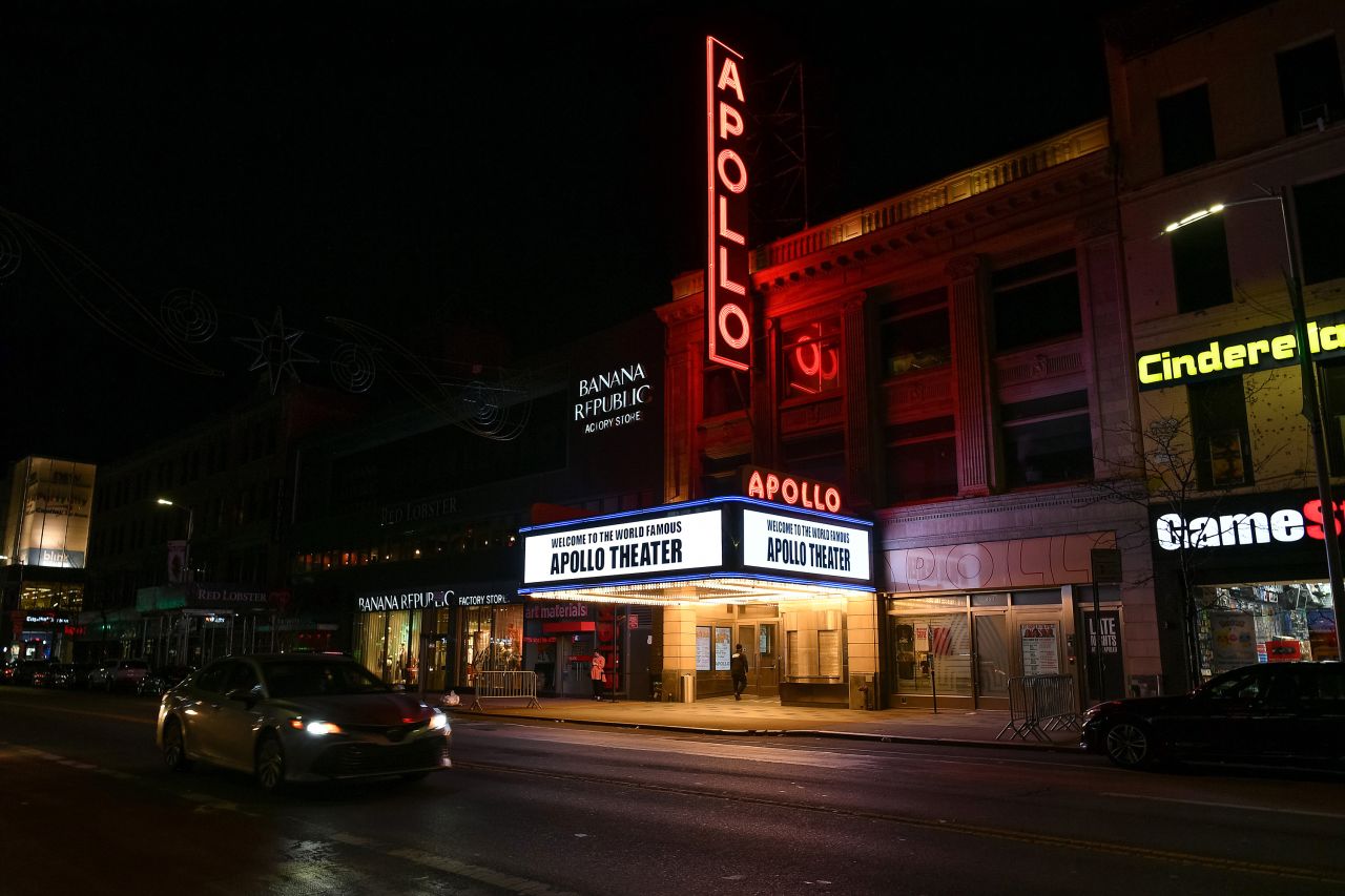 The bright lights of The Apollo Theater marquee light up Harlem.