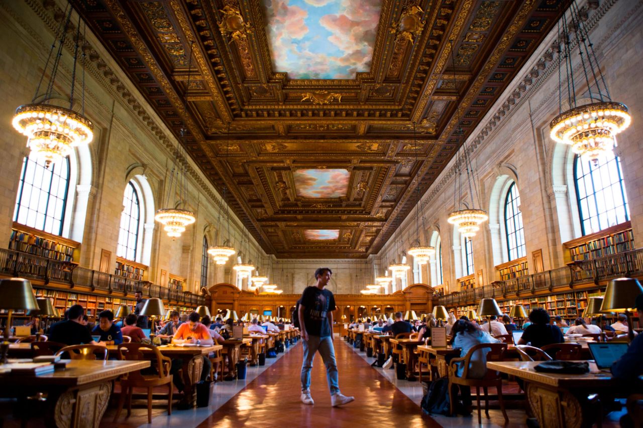 Library goers quietly work in Rose Main Reading Room at the New York Public Library.