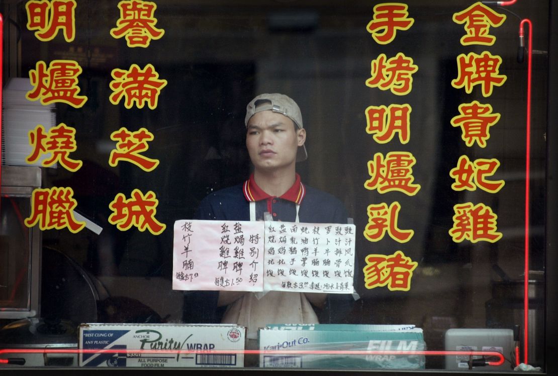 An employee of an empty Chinatown restaurant in Chicago on April 24, 2003, as fears over the SARS epidemic kept customers away.