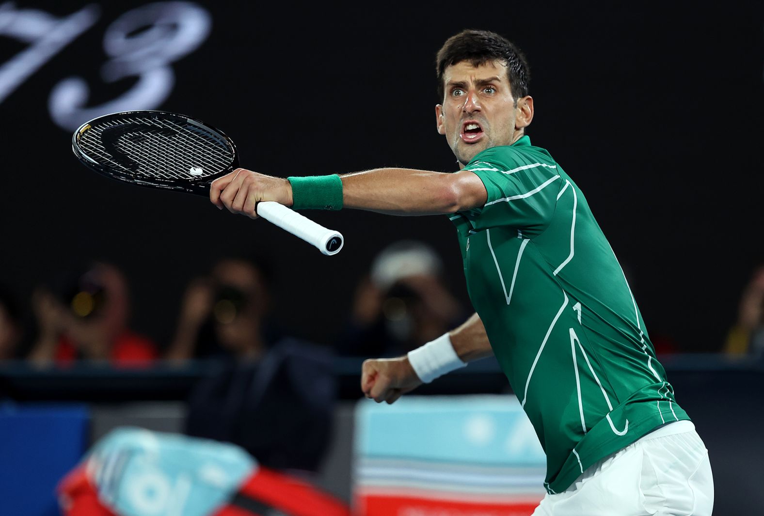 Novak Djokovic celebrates winning the second set against Roger Federer on his way to reaching an eighth Australian Open final on January 30.