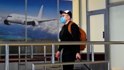 A Ukrainian tourist walks in the arrival hall of the Internatioanal Boryspil airport outside Kiev after his plane landed from China on January 30, 2020.