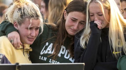  Friends and classmates of Alyssa Altobelli grieve as they look at photos of her during a vigil at Mariners Park in Newport Beach on Thursday.