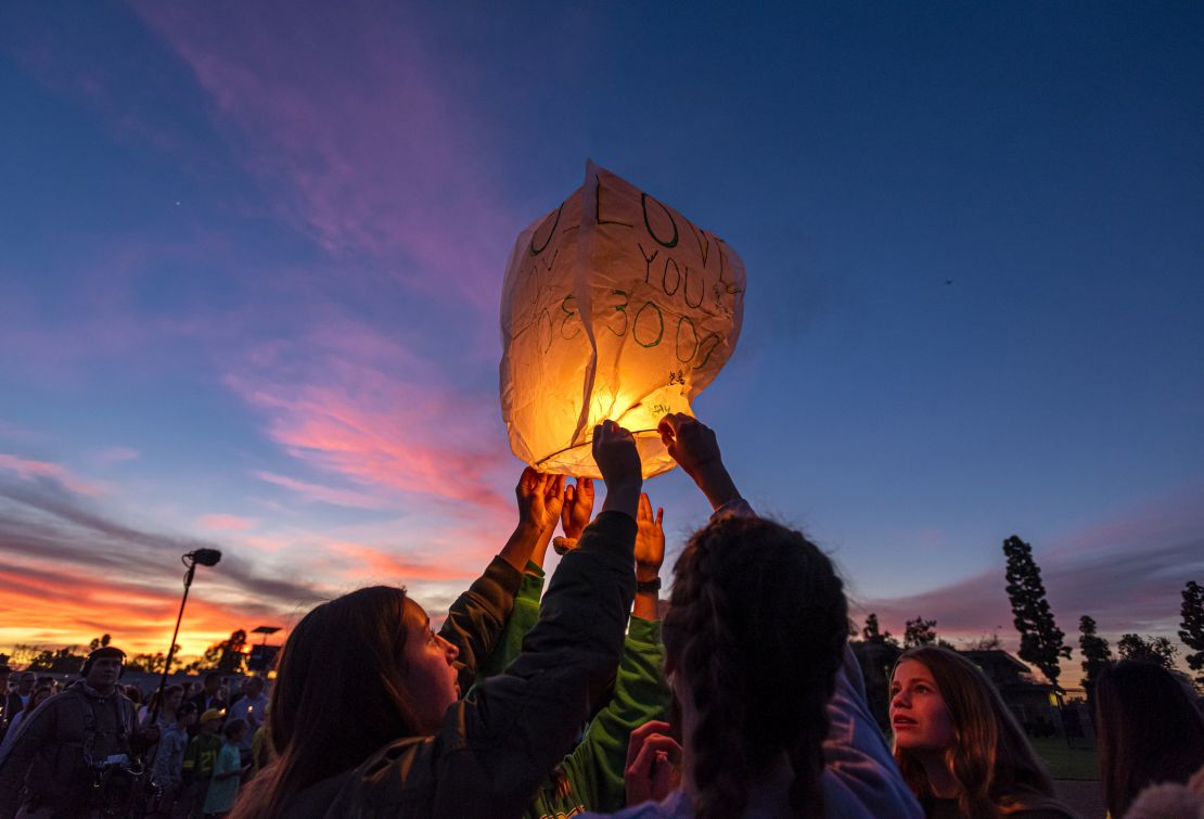 Friends of  Alyssa launch a sky lantern during Thursday's vigil.