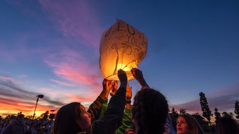 Friends of  Alyssa launch a sky lantern during Thursday's vigil.